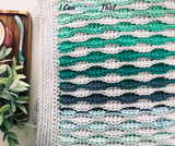 The Beckett Textured Crochet Blanket Pattern with Self-Striping Yarn