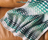 The Beckett Textured Crochet Blanket Pattern with Self-Striping Yarn