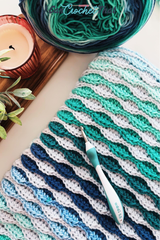 The Beckett Textured Crochet Blanket Pattern with Self-Striping Yarn